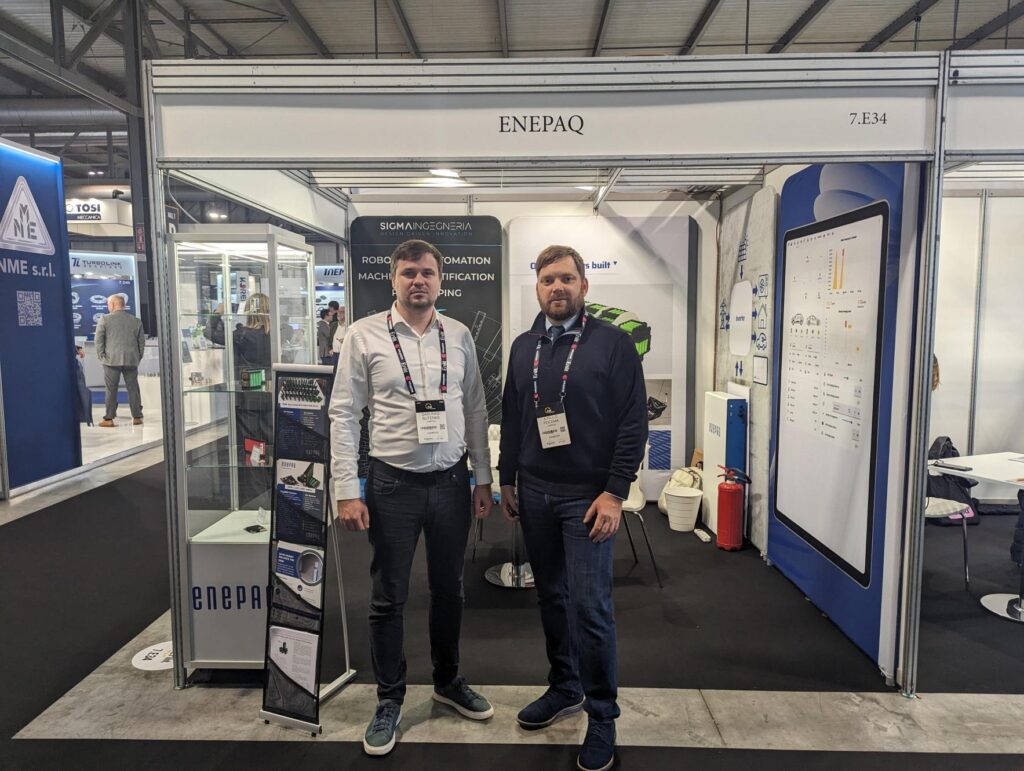 Enepaq CEO Šarūnas Šutėnas with sales manager Jurijus at Enlit 2024 presents energy storage solutions to the visitors of the trade show.